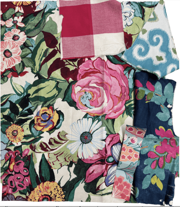 Floral fabric is the hero fabric and buffalo check in pink, graphic blue fabric, and wallpaper sample.
